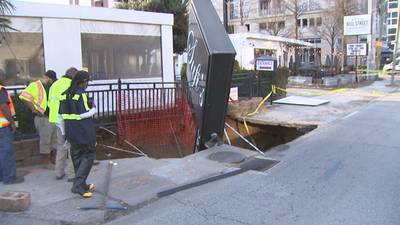 Large hole caused by water main break interrupts traffic, closes businesses on Peachtree Street