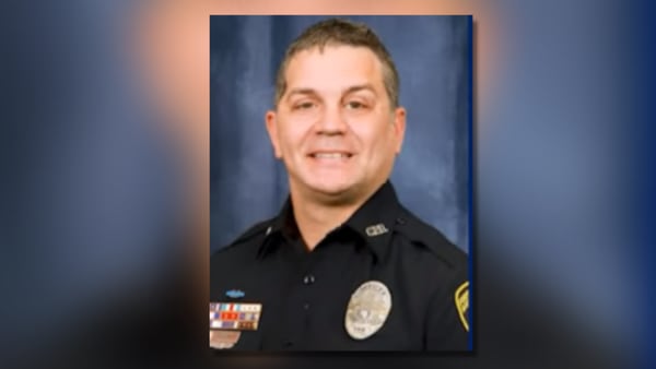 Covington officer who was shot in the head nearly 5 year ago officially retires