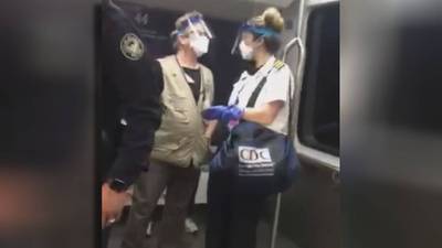 Passengers alarmed as CDC escorts COVID positive person on full plane train