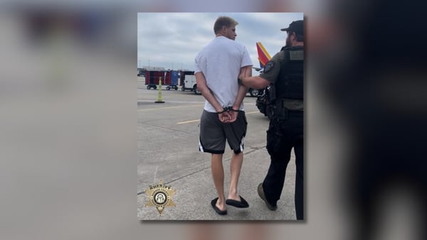 Man walks off plane from vacation. Deputies had something waiting for him once he landed