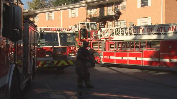 AFD: Fire under investigation after firefighters save 2 people trapped inside