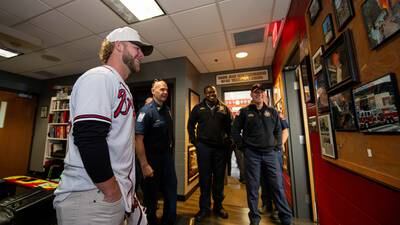 PHOTOS: Braves pitcher AJ Minter surprises firefighters at Cobb station