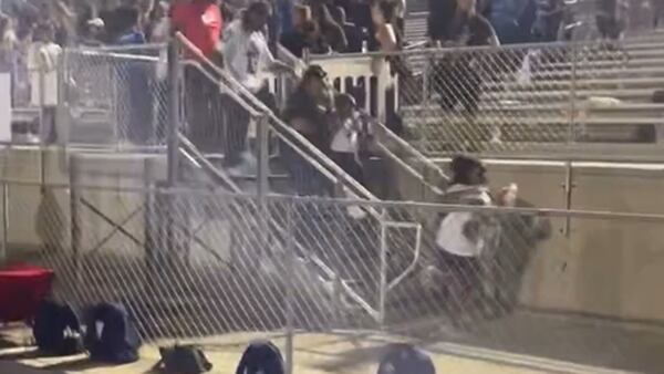School administrators in Gwinnett say students caused panic at high school football game