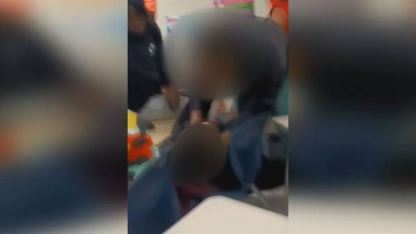 Middle school teacher put on leave after video shows him choking student in class
