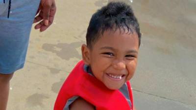 Family, strangers grieve 3-year-old who was killed while watching TV inside his home in Athens