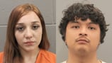 Parents charged months after their 1-month-old twins found dead in crib