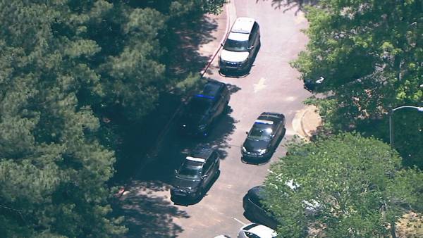 Police ask people to avoid area around middle school as they search for home invasion suspect
