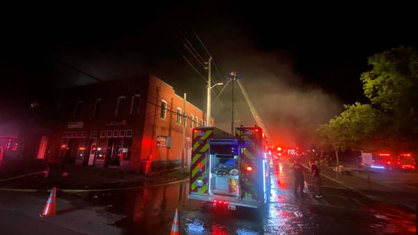 PHOTOS: Fire crews working to put out blaze in Covington Square, multiple businesses aflame