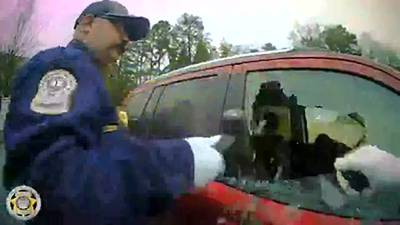 VIDEO: Driver found unconscious behind wheel, police shatter window to wake him up