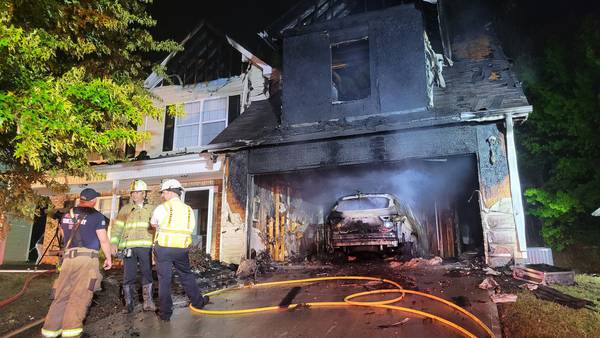 Car bursts into flames in garage destroying Gwinnett County home, fire officials say