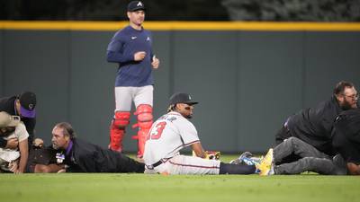 VIDEO: Braves star Acuña Jr. knocked over after fans rush field in middle of game in bizarre scene