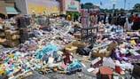 Massive crowd gathers after beauty store’s entire inventory dumped in parking lot during eviction