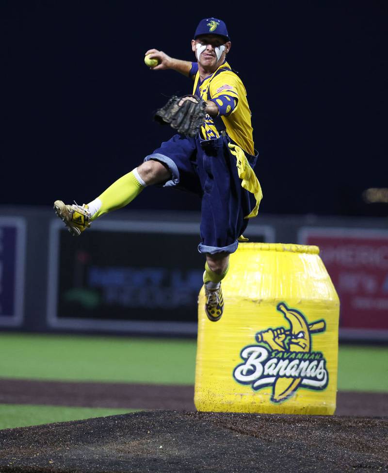 NEW YORK, NEW YORK - AUGUST 12:  Mat Wolf #29 of the Savannah Bananas pitches during their game against the Party Animals at Richmond County Bank Ball Park on August 12, 2023 in New York City.  The Savannah Bananas were part of the Coastal Plain League, a summer collegiate league, for seven seasons. In 2022, the Bananas announced that they were leaving the Coastal Plain League to play Banana Ball year-round. Banana Ball was born out of the idea of making baseball more fast-paced, entertaining, and fun.   (Photo by Al Bello/Getty Images)