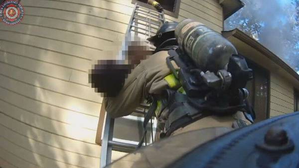 WATCH: Metro firefighters come to the rescue after man collapses while trying to escape house fire