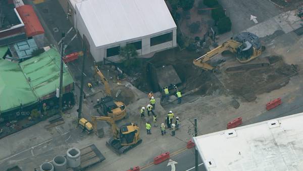 PHOTOS: Crews working to repair massive sinkhole on Peachtree Street