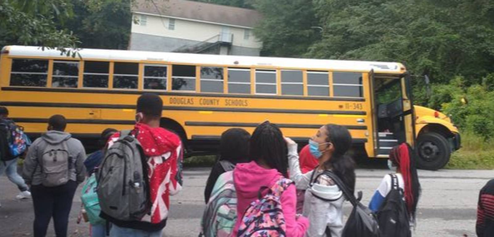 School bus full of Douglas County High School students runs into ditch