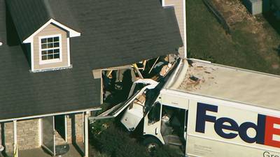 FedEx truck plows into Gwinnett County home, driver injured