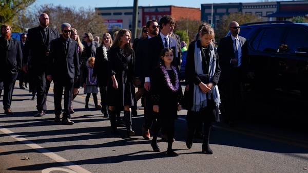 Onlookers surprised as Carter family walks behind motorcade to take former first lady to burial site