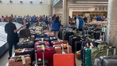 Delta passengers continue to search for missing luggage following IT outage