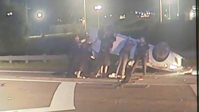 Police, bystanders lift car to rescue teen trapped underneath in Gwinnett County