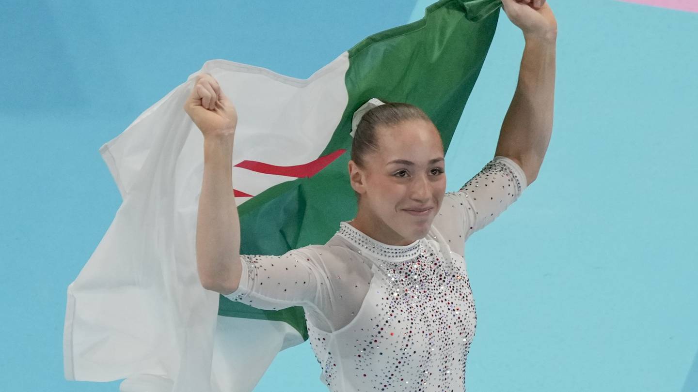 Kaylia Nemour of Algeria wins the gold in uneven bars and Suni Lee