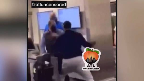 Man in video attacking airport gate worker charged with battery, banned by airline