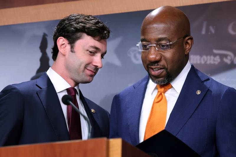 WASHINGTON, DC - SEPTEMBER 28: Sen. Jon Ossoff (D-GA) (L) and Sen. Raphael Warnock (D-GA) hold a news conference with fellow Democratic members of Congress to push for a solar tax credit at the U.S. Capitol on September 28, 2021 in Washington, DC. The House and Senate Democrats are pushing for a refundable tax credit for solar manufacturers to spur domestic production to be included in the budget reconciliation.   (Photo by Chip Somodevilla/Getty Images)
