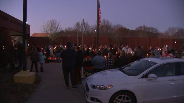 ‘A devastating loss;’ Large crowd gathers to honor fallen Spalding County deputy at vigil