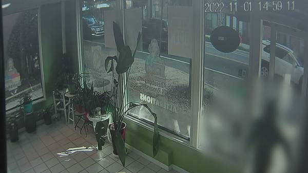 Surveillance video shows teen shot multiple times run into business for help