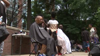 Junior barbers cut hair free of charge for people who are unhoused