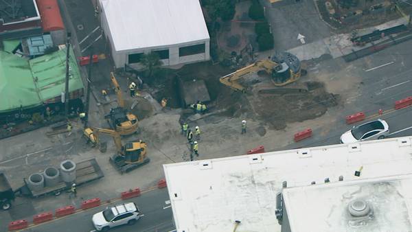 Water restored as crews continue working on massive sinkhole on Peachtree Street in Buckhead