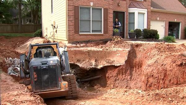 Roswell family say they’re getting no help keeping their home from falling into trash sinkhole