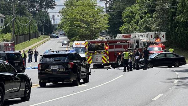At least 1 dead in crash involving motorcycle outside high school in Marietta