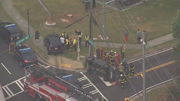 Car overturns during morning commute on busy Cobb County road