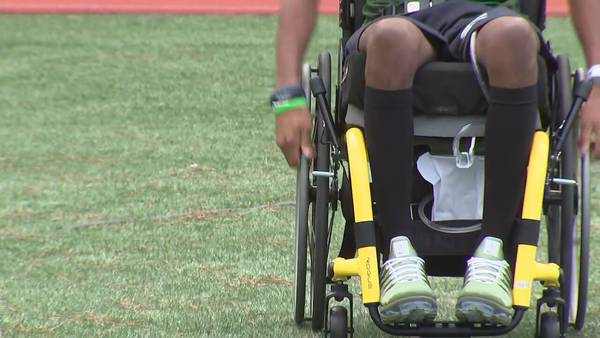 Paralyzed high school football player returns to the field after spinal cord injury