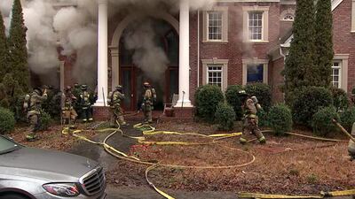 PHOTOS: Family escapes after Buckhead mansion catches on fire