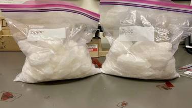 Roswell police find pounds of meth after pulling over driver using phone