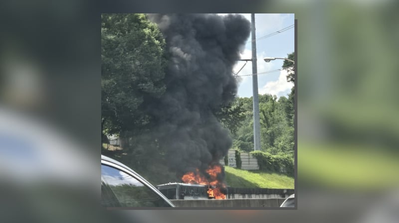 Bus on fire on I-75 near Howell Mill Road in Atlanta