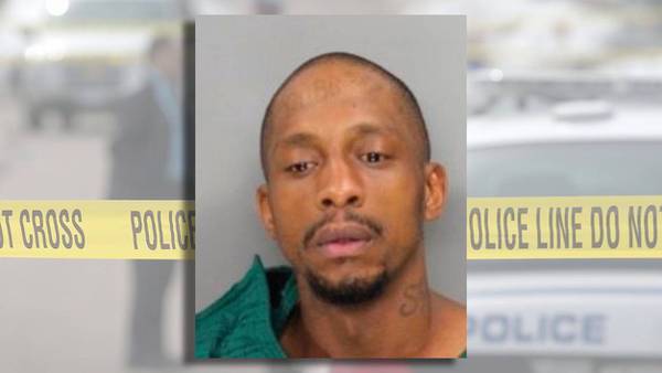 Man arrested after hiding in backseat to carjack victim, police say