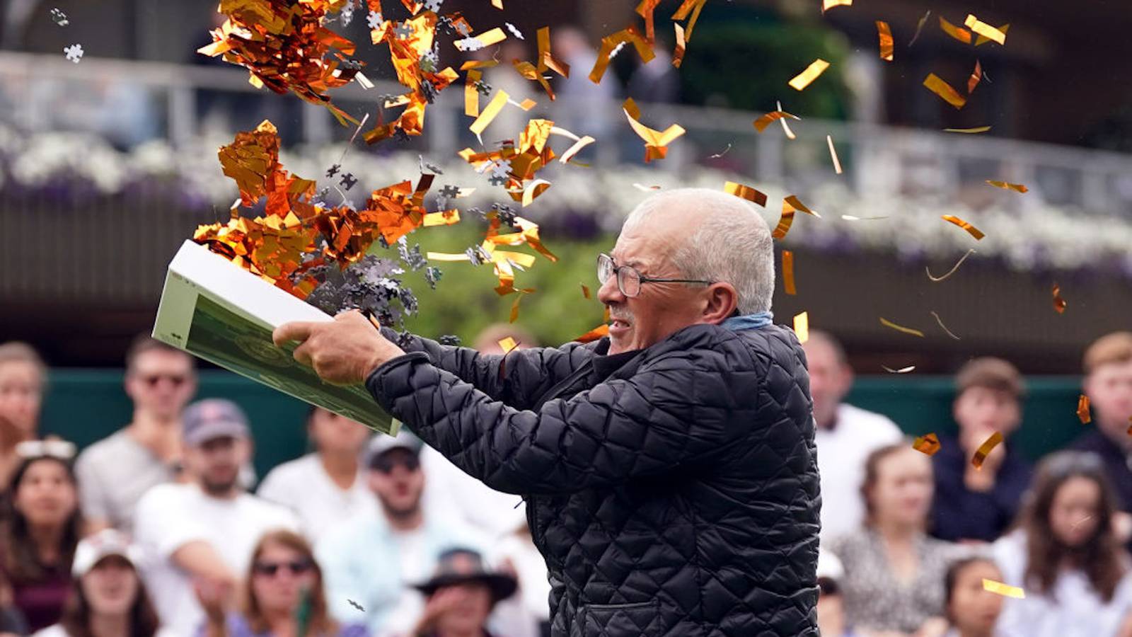 Protesters disrupt Wimbledon match, toss orange confetti, jigsaw pieces