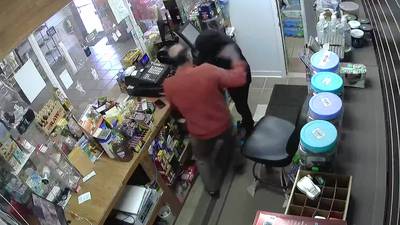 Video shows store clerk tackle robber with gun, chase him out of store in Gwinnett County