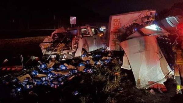 Truck carrying cases of Bud Light overturns on I-75 in Bartow County