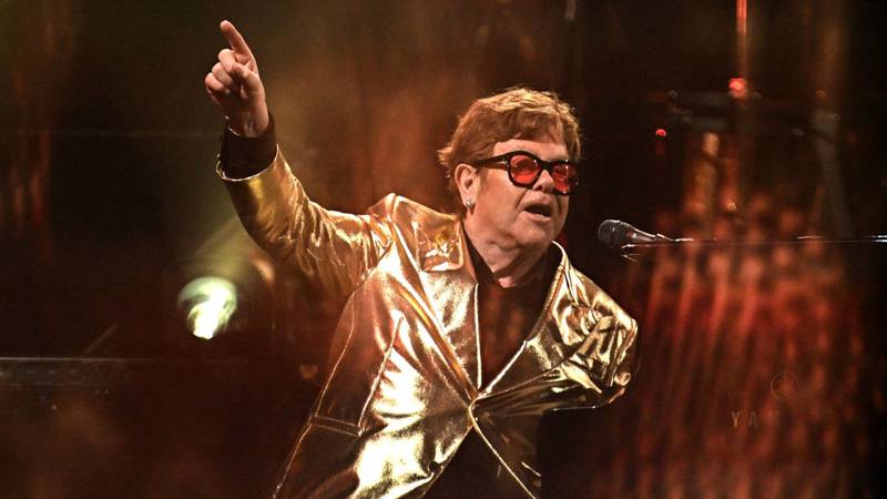 Elton John performing on stage