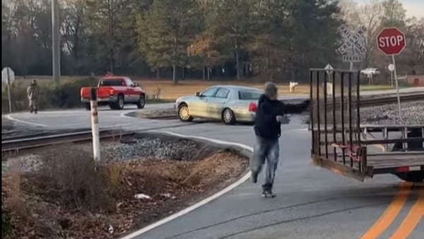 Video shows train plow into car seconds after driver escapes