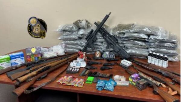DKPD: Drug bust leads to seizure of a dozen guns, stolen car worth $162K