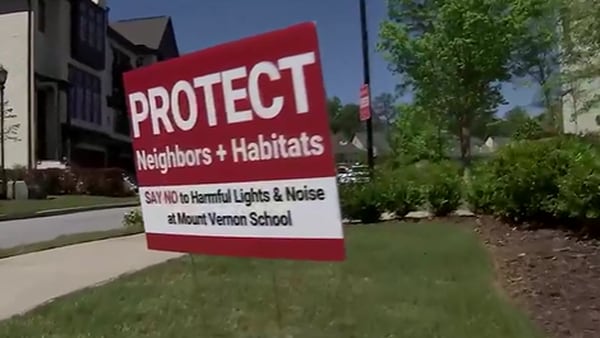 Signs protesting Sandy Springs school’s plan to add stadium lights stolen, neighbors say