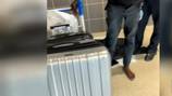 Man uses tracking device to find stolen luggage, another man wearing his clothes at Atlanta airport