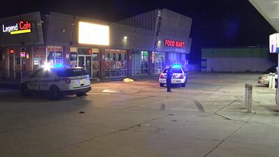 Man found shot to death in gas station parking lot; clerk says gunfire rang out at restaurant
