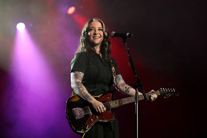 Ashley McBryde performing on stage