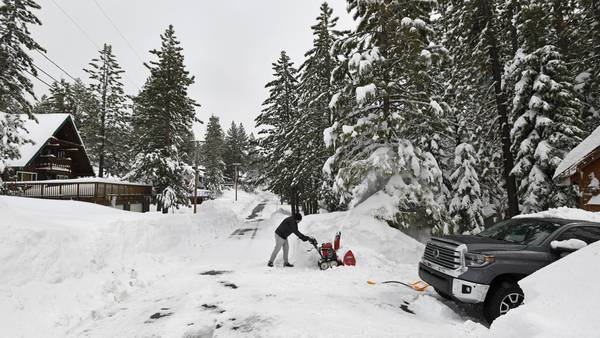 California ski resort workers tunnel their way into the office after getting 10 feet of snow